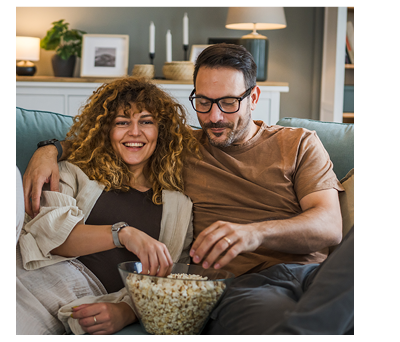 Couple watching movie with popcorn
