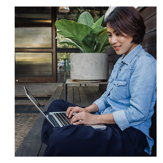 woman working on laptop outdoors