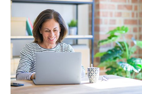 Woman working on laptop at desk