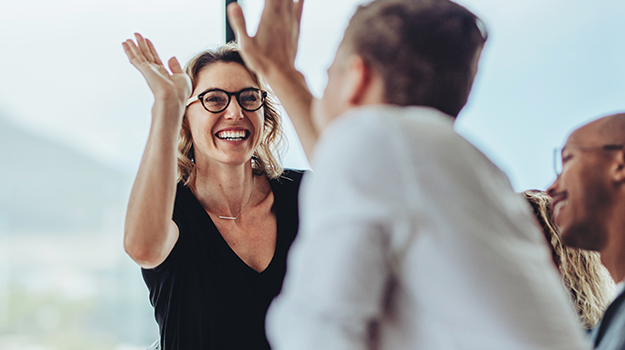 employees giving a high-five